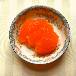 Close up of orange jello salad in bowl