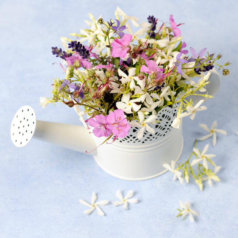 Pastel Flower Arrangement in White Watering Can