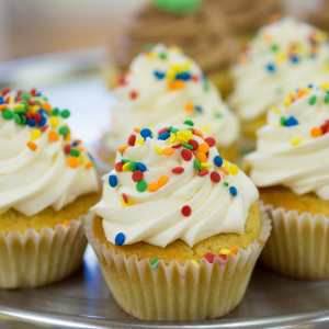 vanilla cupcakes with frosting and sprinkles