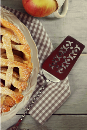 vintage pie server beside an apple pie